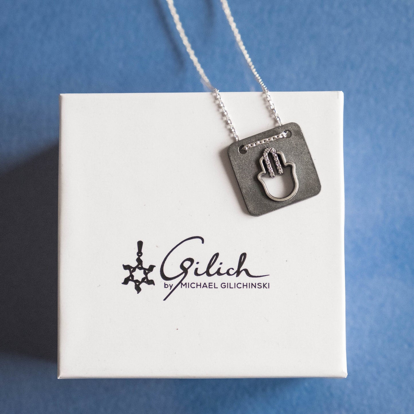 Modern Hamsa Necklace with natural diamonds