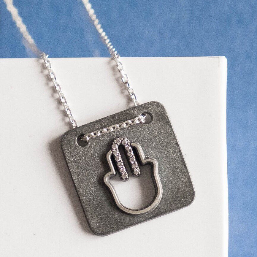 Modern Hamsa Necklace with natural diamonds